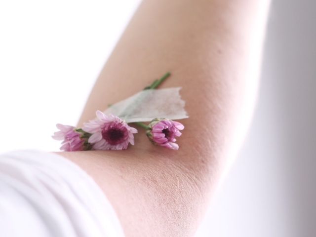 Photo of flowers taped to arm crease