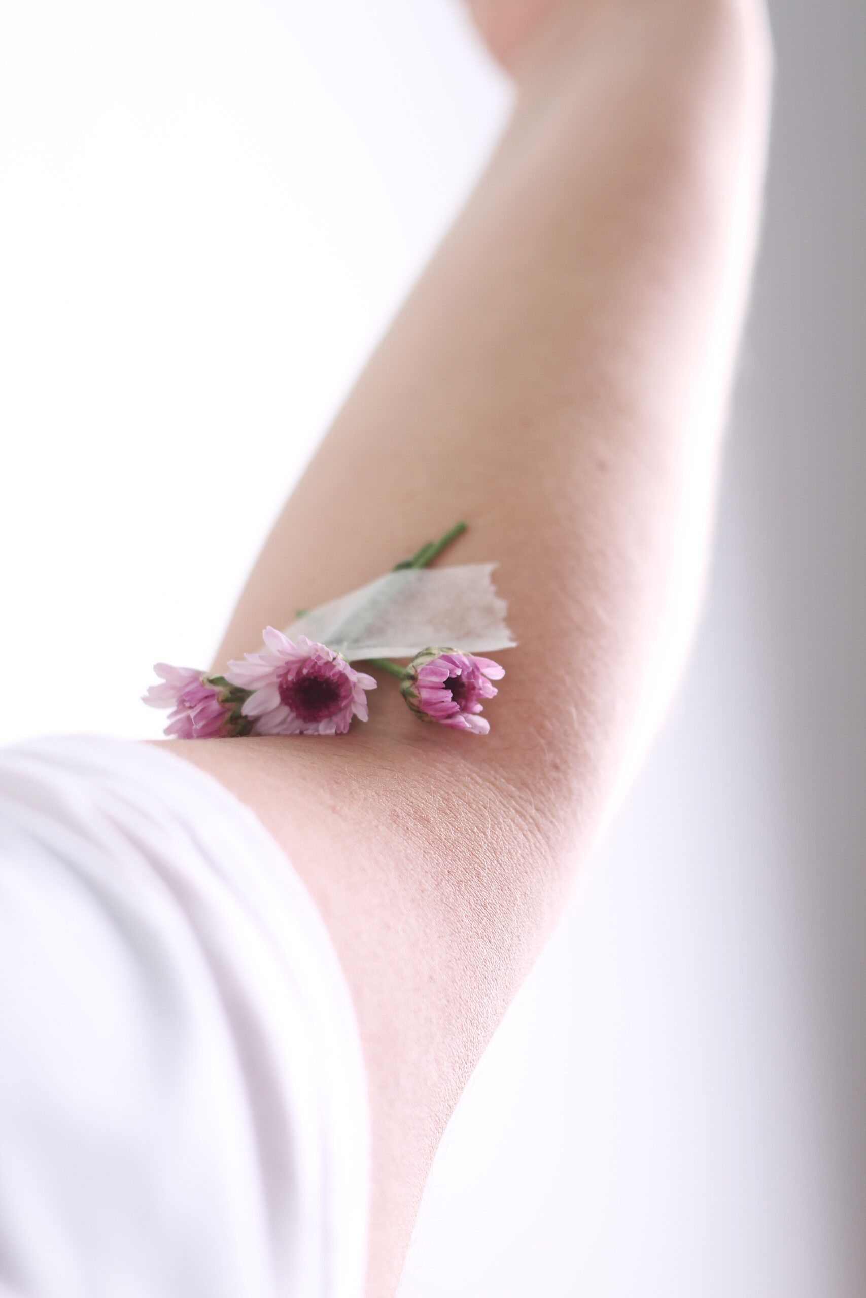 Photo of flowers taped to arm crease